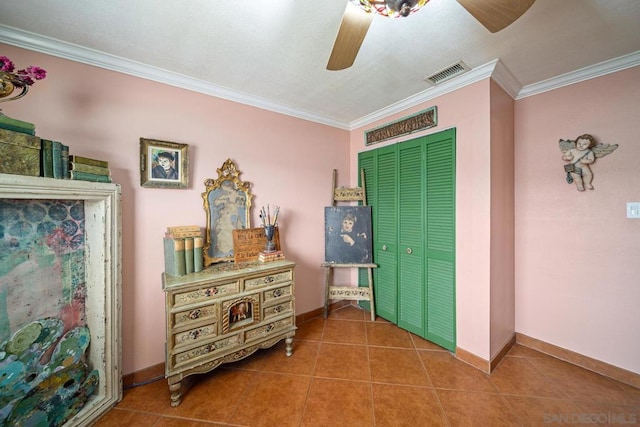 interior space featuring crown molding and tile patterned flooring