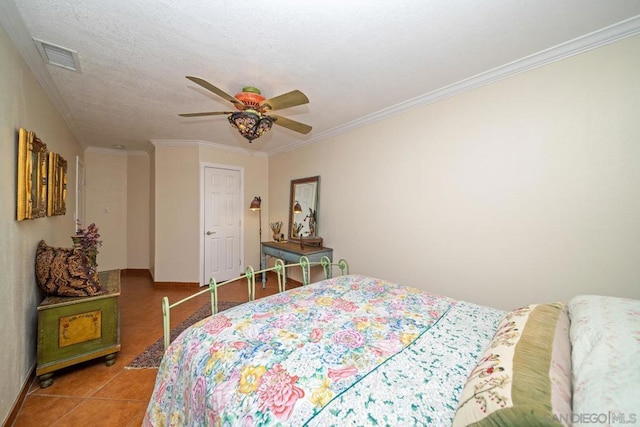 bedroom featuring ceiling fan, ornamental molding, and tile patterned flooring