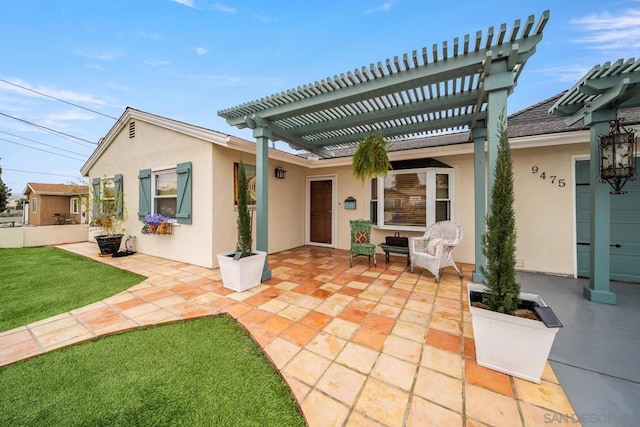 back of property featuring a pergola, a patio area, and a yard