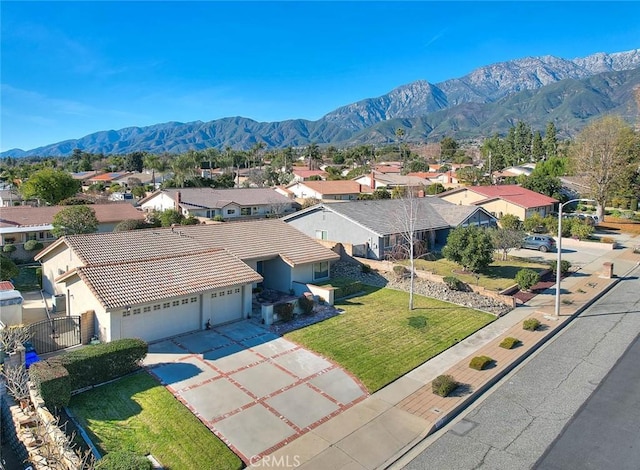 birds eye view of property featuring a mountain view