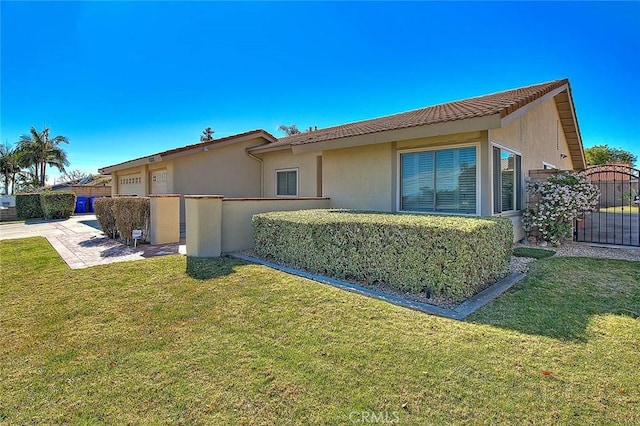 view of side of property with a yard