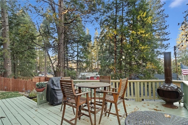 wooden deck with area for grilling