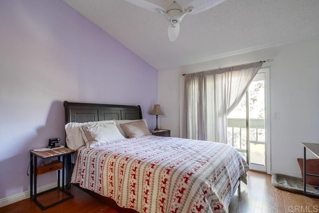 bedroom with ceiling fan, lofted ceiling, access to outside, and multiple windows