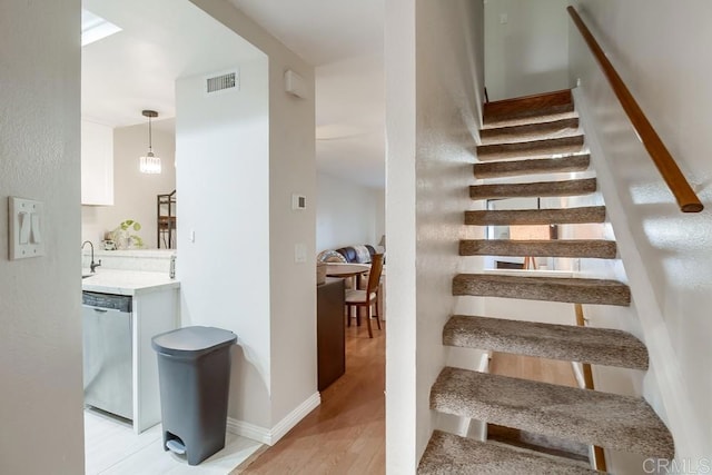 stairway featuring hardwood / wood-style floors