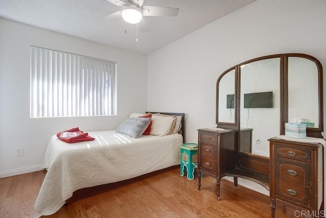 bedroom featuring light wood-type flooring and ceiling fan