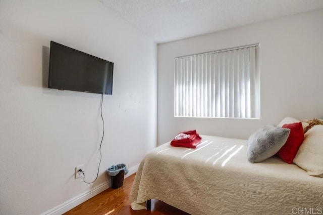 bedroom featuring hardwood / wood-style flooring