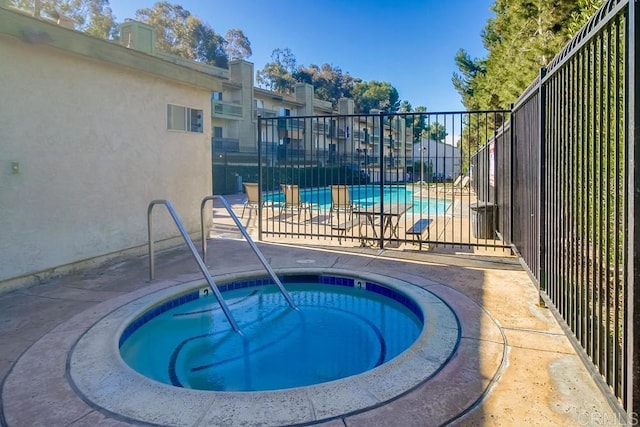 view of pool featuring a community hot tub