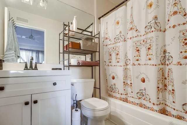 full bathroom featuring toilet, vanity, ceiling fan, and shower / tub combo with curtain