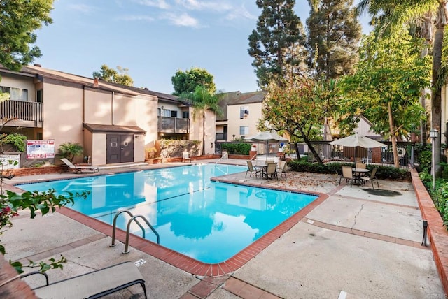 view of pool featuring a patio