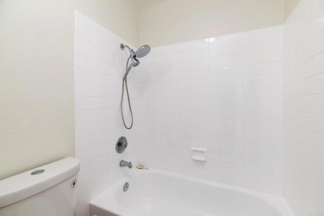 bathroom featuring toilet and shower / washtub combination