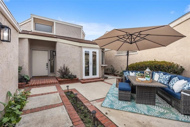 view of patio featuring outdoor lounge area and french doors