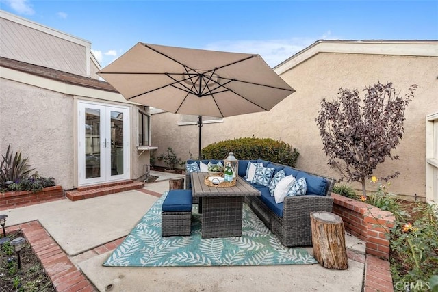 view of patio / terrace with french doors and an outdoor living space