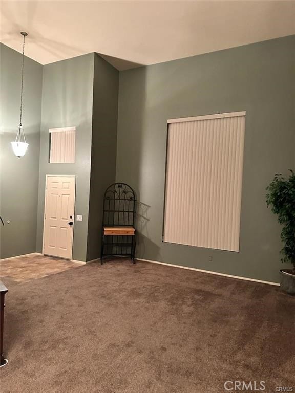 unfurnished room featuring carpet