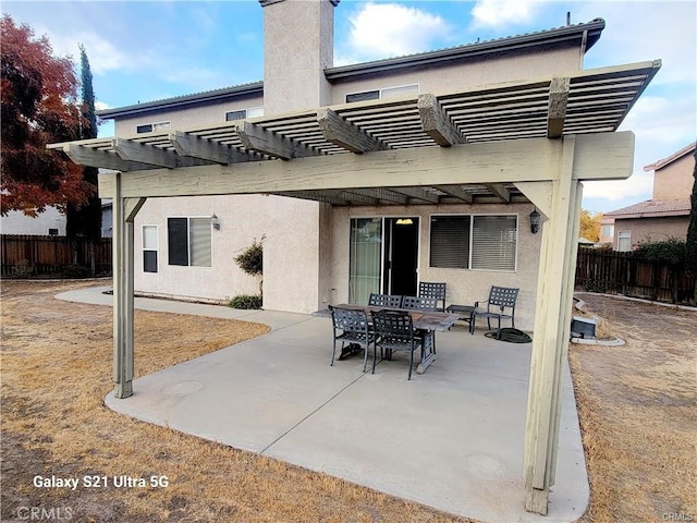 back of house featuring a pergola and a patio area