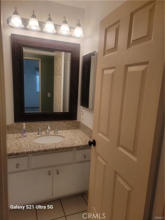 bathroom with vanity and tile patterned flooring