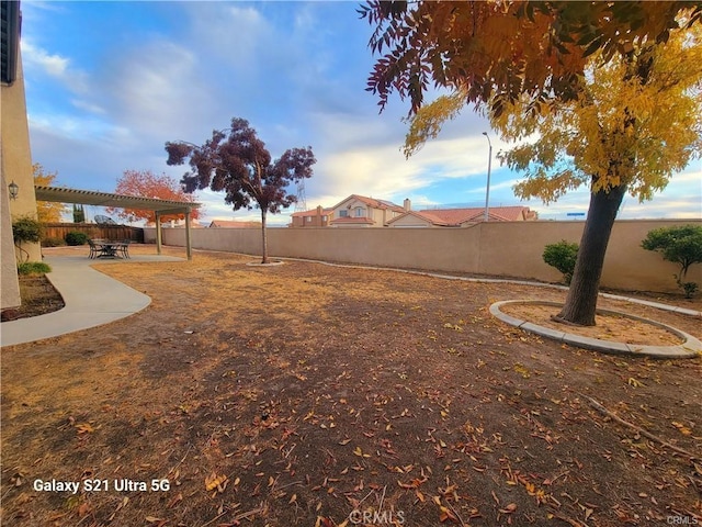 view of yard featuring a patio area and a pergola