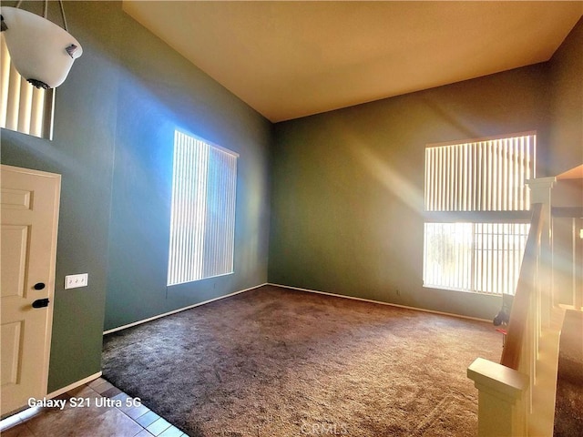 view of carpeted foyer entrance