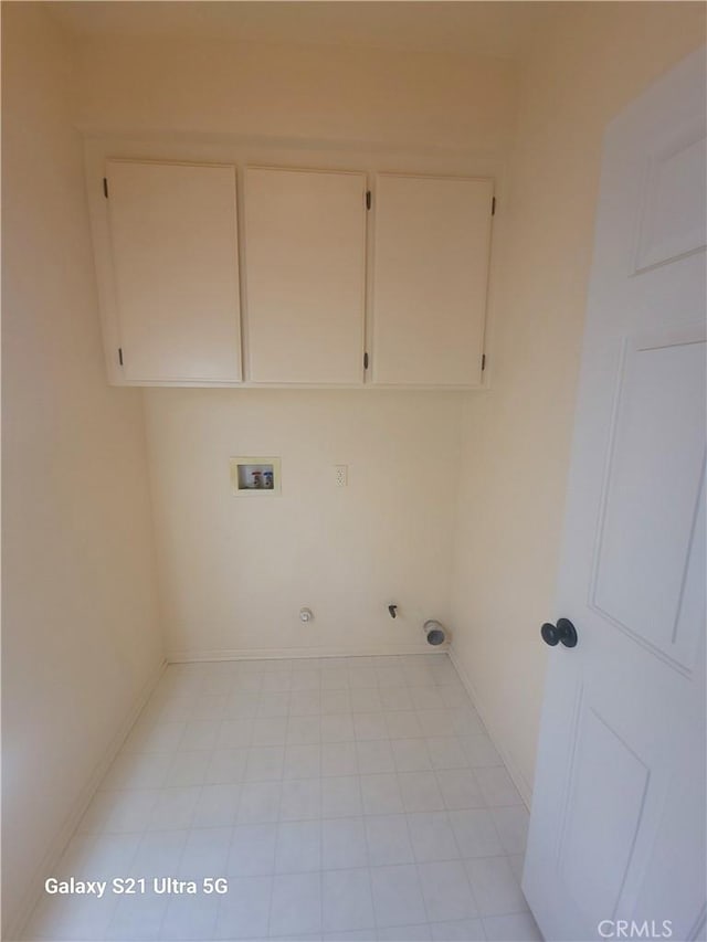 washroom featuring gas dryer hookup, cabinets, and washer hookup