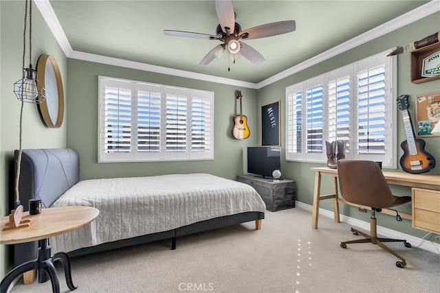 carpeted bedroom with crown molding and ceiling fan