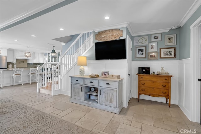 living room with ornamental molding