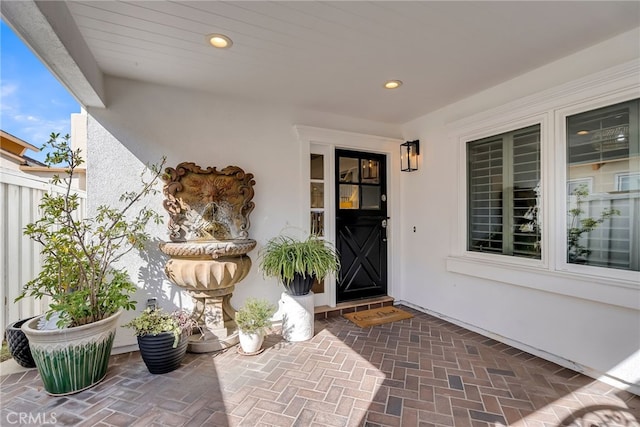 property entrance featuring a patio