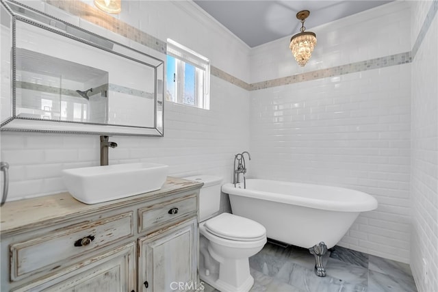 bathroom with a bathing tub, sink, and toilet