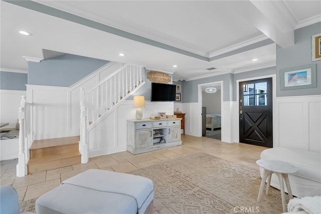 living room with light tile patterned flooring and ornamental molding