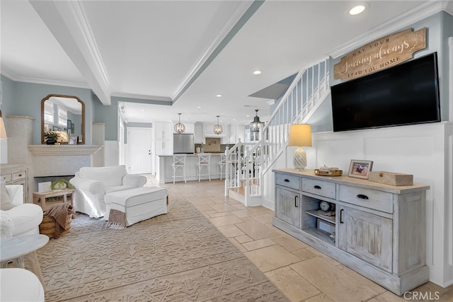 living room featuring crown molding