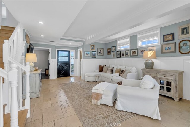 living room featuring crown molding