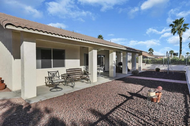 rear view of house featuring a patio area