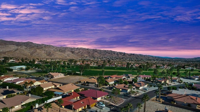 aerial view at dusk with a mountain view