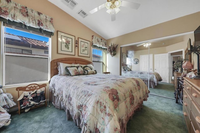 bedroom featuring ceiling fan, vaulted ceiling, a closet, and dark colored carpet