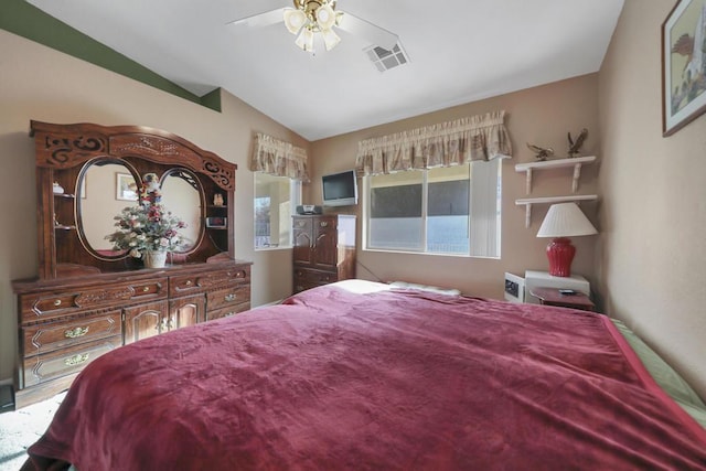 bedroom with lofted ceiling and ceiling fan