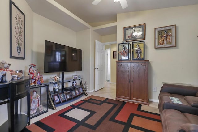 tiled living room with ceiling fan and lofted ceiling