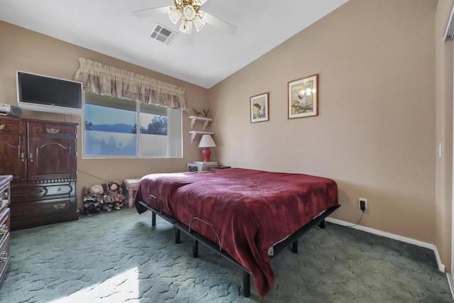 bedroom with ceiling fan, lofted ceiling, and carpet flooring