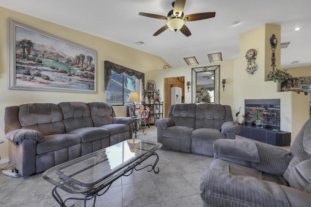 tiled living room featuring vaulted ceiling and ceiling fan