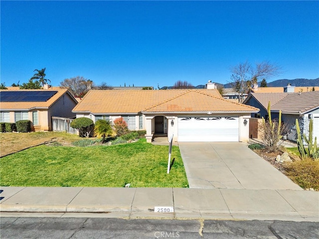 ranch-style house with a front lawn and a garage