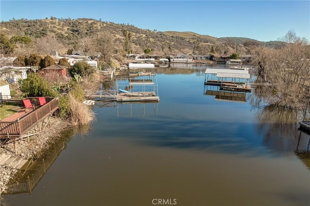 dock area featuring a water and mountain view