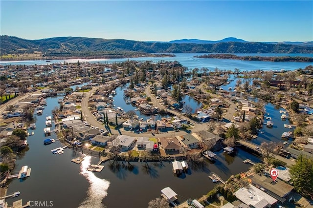 bird's eye view featuring a water and mountain view