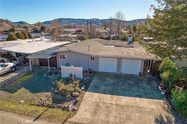 view of front of property with a mountain view and a garage