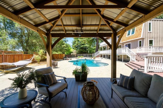 view of pool with a deck, a gazebo, and an outdoor hangout area