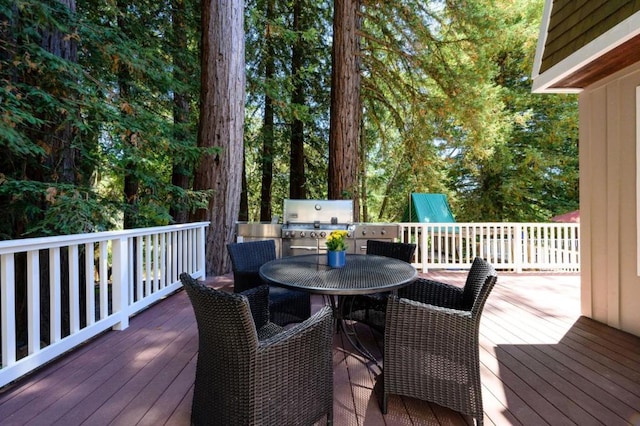 wooden deck with a grill