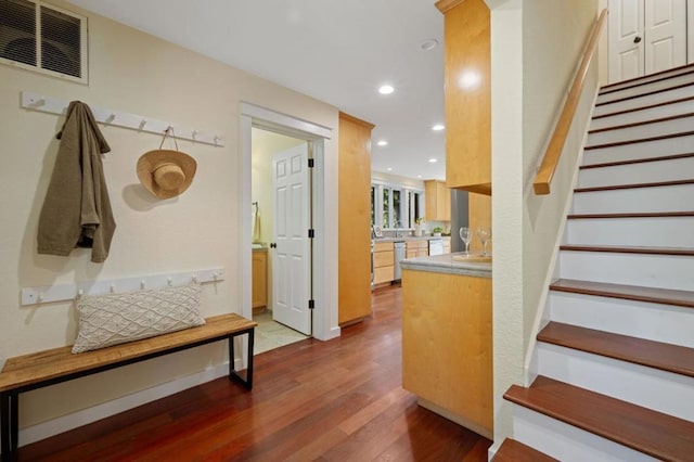 mudroom featuring wood-type flooring