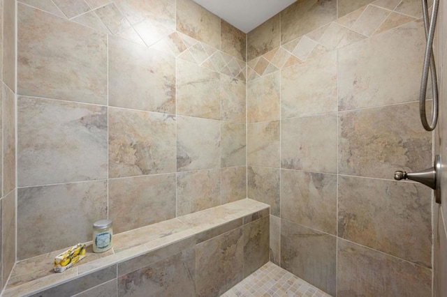 room details featuring a tile shower