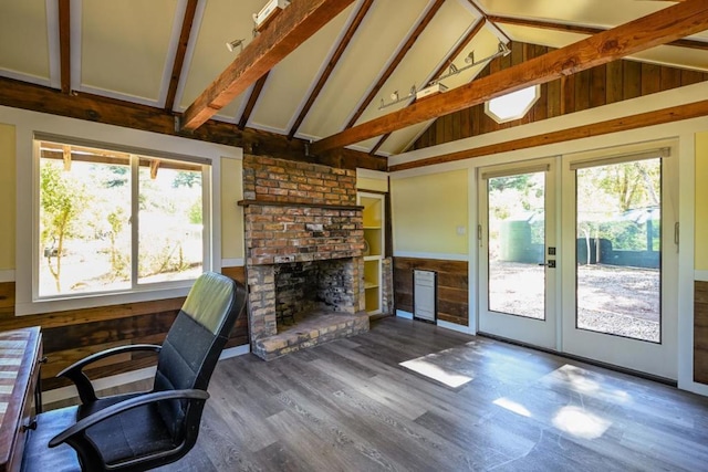 office area featuring hardwood / wood-style flooring, a fireplace, and vaulted ceiling with beams