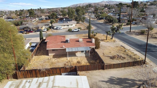 birds eye view of property featuring a mountain view