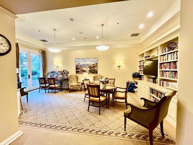 interior space featuring built in shelves, ornamental molding, and french doors