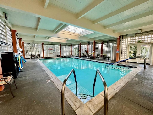 view of swimming pool with french doors and a patio area