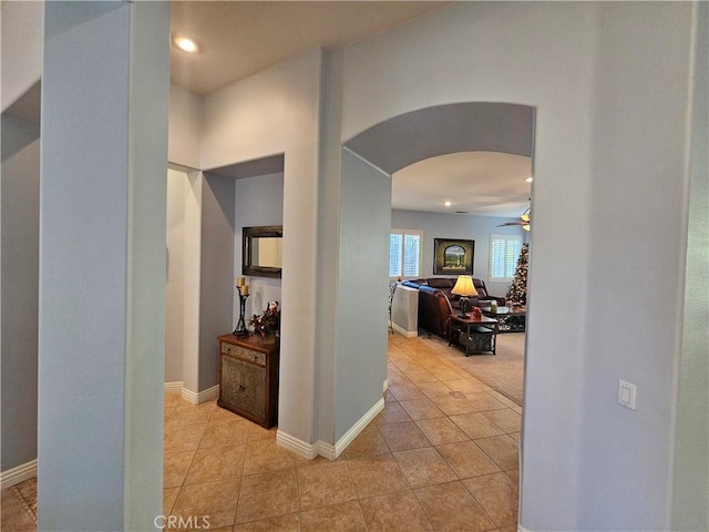 hall featuring light tile patterned flooring