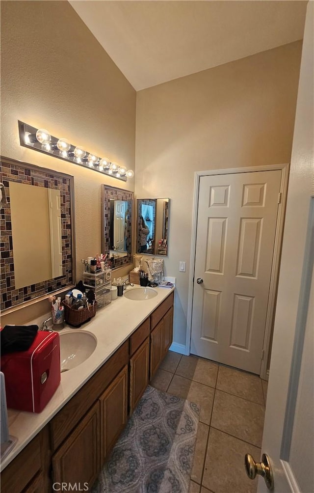 bathroom featuring tile patterned flooring and vanity